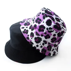 Reversible bucket hat for men and women, featuring black and purple leopard print, summer sun cap.