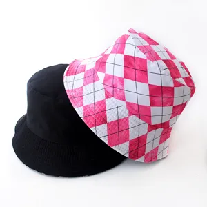 Detailed view of a pink checkered bucket hat paired with a classic solid black bucket hat