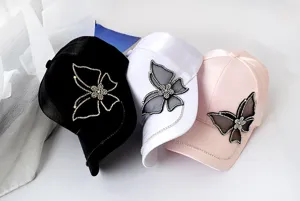 Detailed view of women rhinestone butterfly baseball cap, stylish satin sun hat in colors.