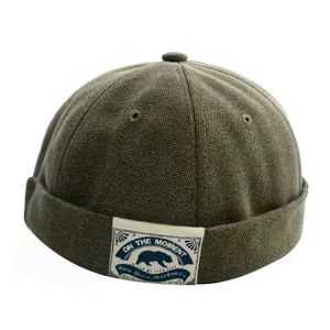 Vintage Canvas Docker Mütze für Herren, retro schirmlose Seemannsmütze mit Logolabel.