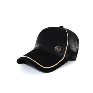 Black fashion baseball cap with metallic gold trim and letter badge for stylish sun protection.