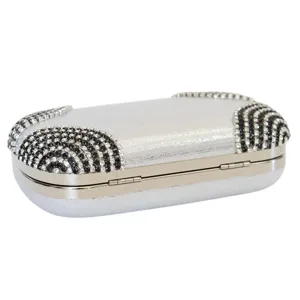 Elegant silver evening clutch bag with black and white rhinestone corner accents