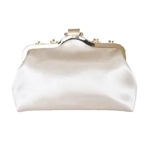 Elegant vintage white satin evening clutch bag with ornate gold hardware for formal events.