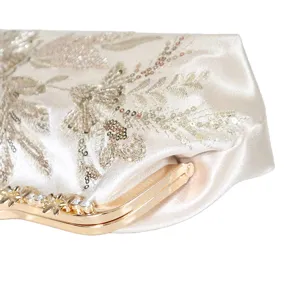 Vintage embroidered evening clutch bag with sequins and sparkling rhinestone clasp detail
