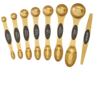 Magnetic gold stainless steel double-ended measuring spoons set with leveler for baking.