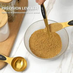 Stainless steel measuring spoons set with leveler tool for precise baking and cooking measurements.