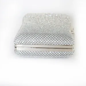 Elegant silver bow-tie shaped rhinestone evening clutch bag with aluminum mesh detail
