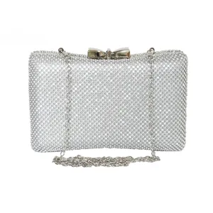 Elegant silver rhinestone evening clutch bag with sparkling bow-shaped clasp for party
