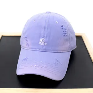 Lavender distressed baseball cap with cute L embroidery and stylish brim text for casual wear.
