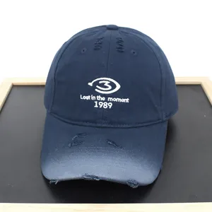 Vintage navy blue distressed baseball cap featuring "Lost in the moment 1989" embroidery.