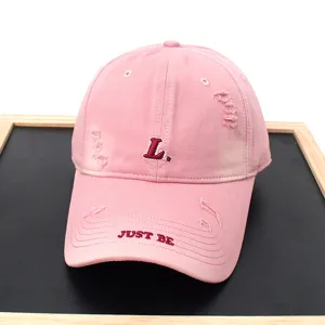 Pink distressed baseball cap with L embroidery and Just Be text, casual street style hat.
