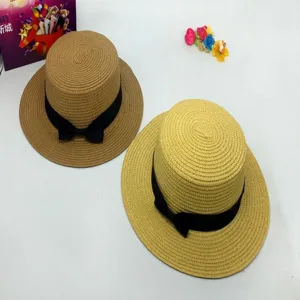 Women summer straw hat flat top sunhat with black ribbon bow beach fashion casual wear.