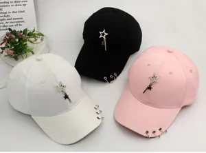 Detailed view of stylish baseball caps featuring star pendants and metal rings in three colors
