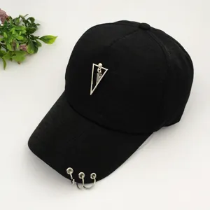 Trendy black baseball cap with punk metal triangle charm and three rings on the brim