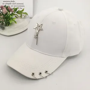 White women's baseball cap featuring a metallic star pendant and iron rings on the brim