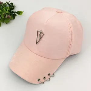 Fashionable pink summer baseball cap with silver metal rings and triangle pendant details