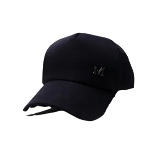 Stylish classic black baseball cap for men and women featuring silver metal M logo decoration