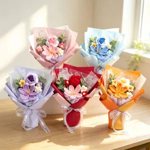 Detailed view of five colorful handmade knitted crochet flower bouquets on a table
