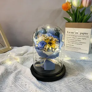 LED soap flower bouquet in glass dome featuring blue roses and yellow sunflower for gifts