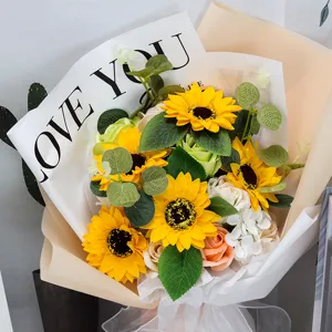 Detailed macro view of artificial sunflower bouquet with Love You wrapping for Teacher's Day gift
