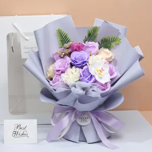 Detailed view of elegant purple artificial soap flower bouquet with gift bag and greeting card.