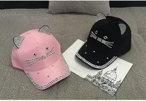 Close-up of cute cat ear baseball caps with shiny rhinestone whiskers and mesh back
