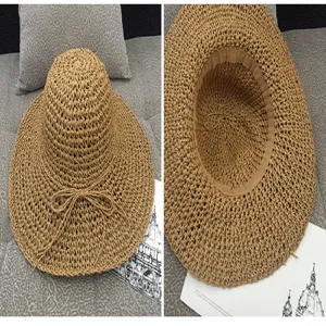 Detailed view of women's straw sun hat featuring woven texture, decorative bow, and inner lining