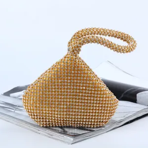 Elegant gold rhinestone evening clutch bag with unique triangle design and loop handle