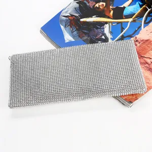 Elegant silver rhinestone evening clutch bag, sparkling design for parties and events.