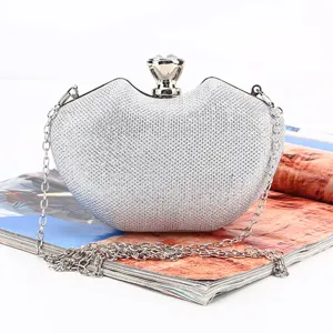 Silver heart-shaped rhinestone evening clutch bag with elegant chain strap and crystal clasp