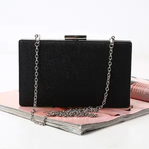 Elegant black evening clutch bag with silver chain strap, perfect for parties and formal events.