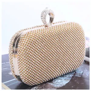 Luxury rhinestone evening clutch bag with unique ring handle, sparkling crystal party bag.