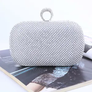 Exquisite rhinestone evening clutch bag with sparkling crystals and unique ring handle for party.