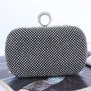 Elegant black rhinestone evening clutch bag featuring sparkling crystal ring handle for parties.