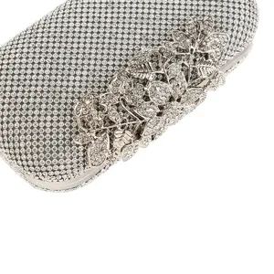 Elegant silver rhinestone evening clutch bag with ornate floral leaf crystal clasp.