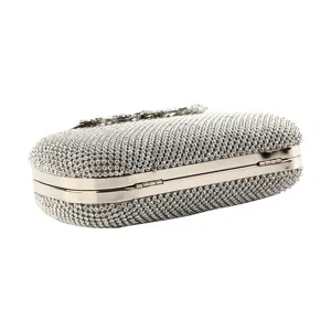 Elegant silver rhinestone evening clutch bag with sparkling leaf-shaped metal clasp for party
