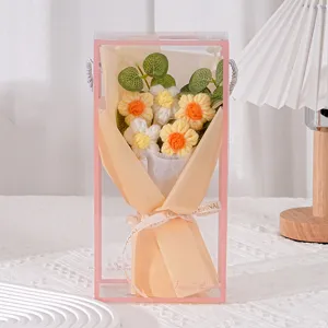 Handmade crochet knitted daisy flower bouquet detail view in clear gift box, perfect romantic gift.