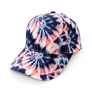 Tie-dye baseball cap detail view, vibrant colorful pattern, casual outdoor sun protection hat.