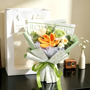 Handmade crochet flower bouquet featuring heart shapes and mixed flowers in romantic gift wrapping