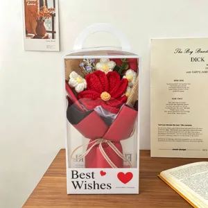 Crochet knitted flower bouquet in transparent gift box handmade home decor detail view