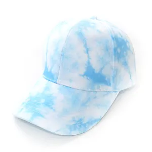 Close-up detail of the blue and white tie-dye baseball cap showing fine fabric and stitching.