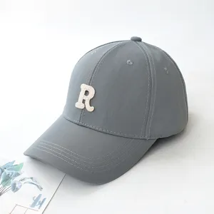 Stylish gray baseball cap featuring a white embroidered letter R on a white background