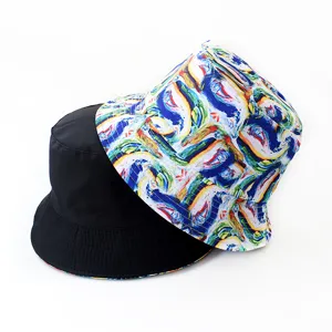 Detail shot of a reversible bucket hat showing black and colorful abstract art printed sides.