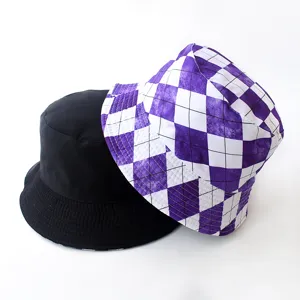 Detailed view of reversible bucket hats in solid black and purple diamond checkered pattern