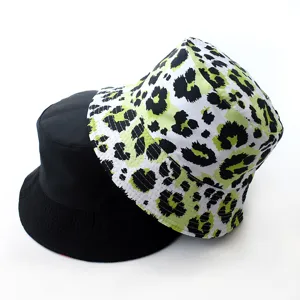 Reversible bucket hat for men and women, stylish neon green leopard print and classic black design.