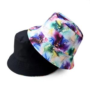 Unisex reversible bucket hat with colorful ink splash print and solid black side for outdoor.