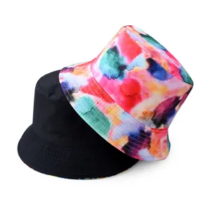 Detailed view of the reversible bucket hat, showcasing solid black and vibrant colorful print.
