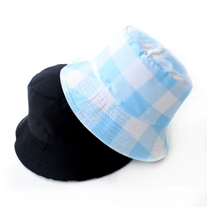 Detailed view of a solid black bucket hat and a light blue checkered patterned bucket hat.