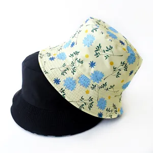 Detailed view of reversible black and floral print bucket hats