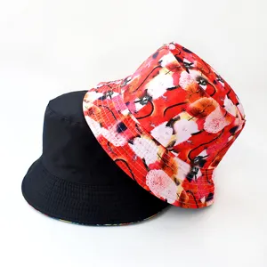 Detail shot of reversible bucket hat, black and red artistic digital print fabric design.